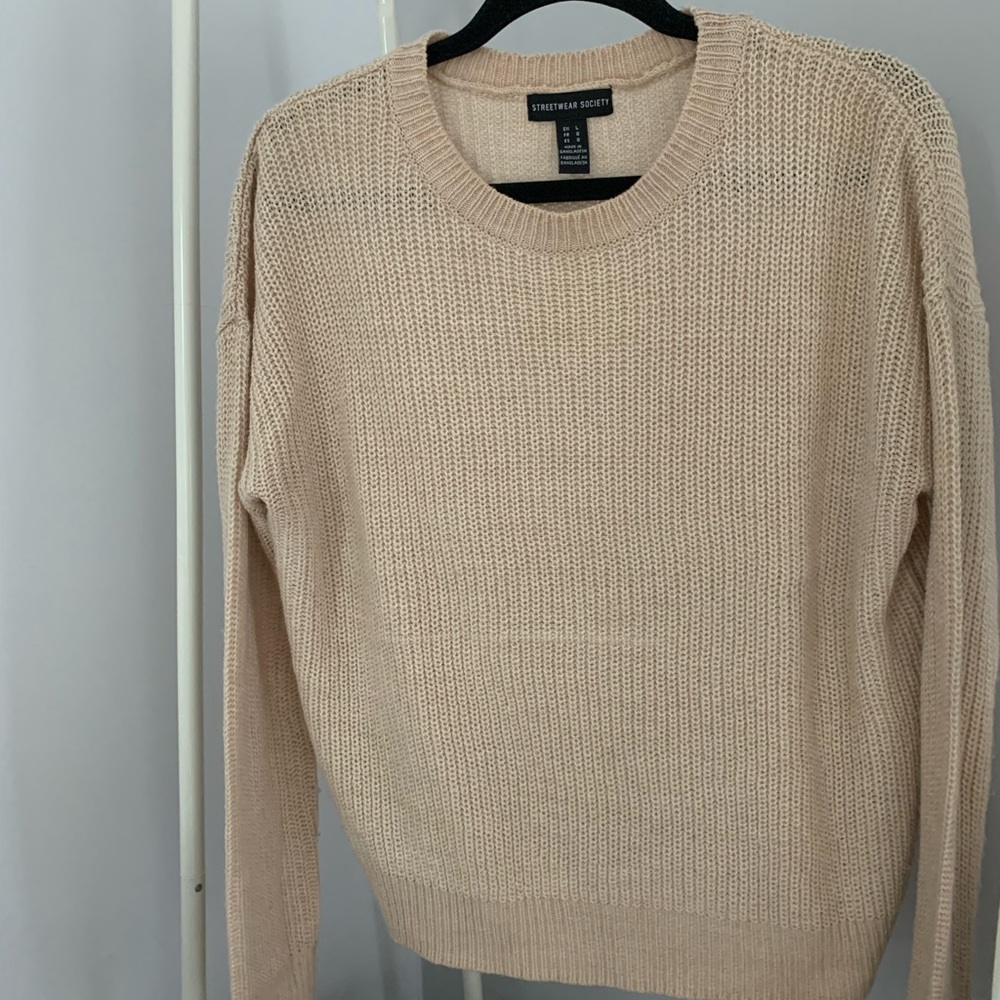 Beige sweater in size Large.